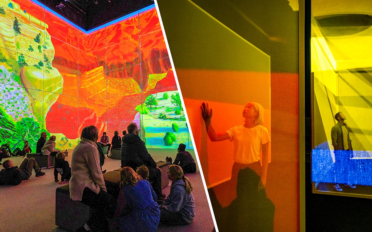 Visitors engaging with immersive David Hockney art at Frameless London exhibit.