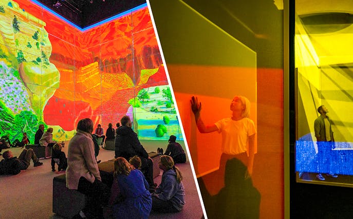 Visitors engaging with immersive David Hockney art at Frameless London exhibit.