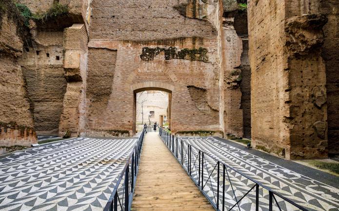 Walkway through ancient ruins at Terme di Caracalla, Rome, Italy.