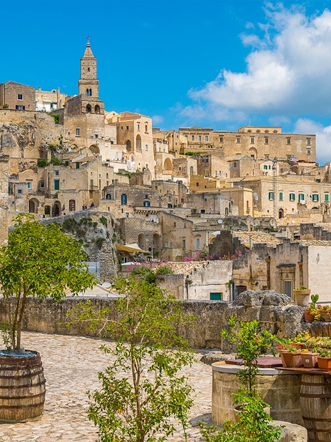 Sassi of Matera stone buildings and courtyard on a sunny day, Italy.