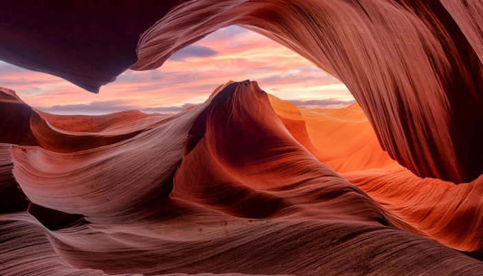 Antelope Canyon's narrow sandstone walls with light beams in Arizona.