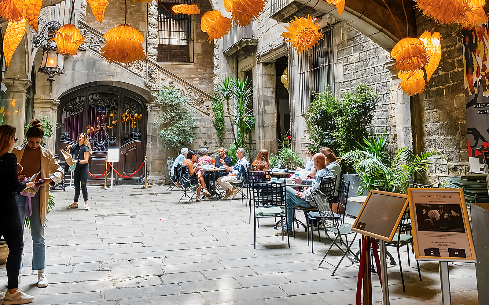 Courtyard at Palau Dalmases with people dining before a flamenco show in Barcelona.