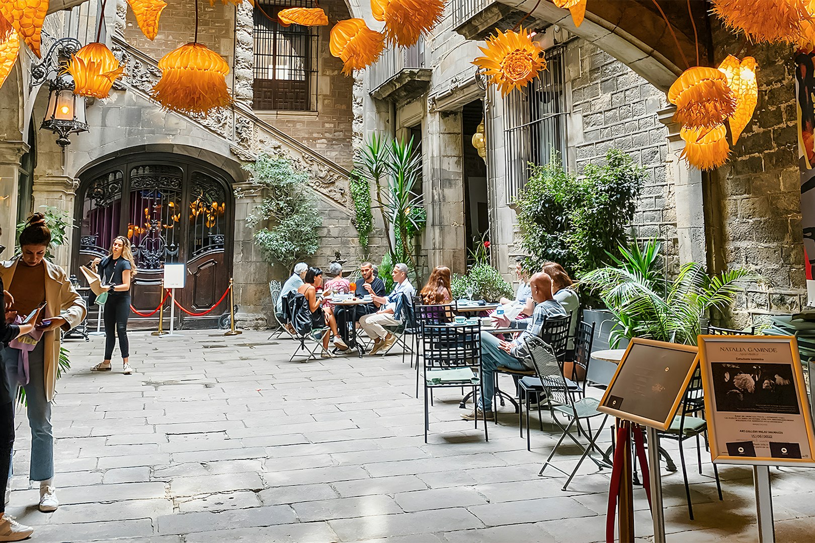 Courtyard at Palau Dalmases with people dining before a flamenco show in Barcelona.
