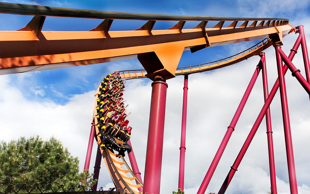 Roller coaster loop at Six Flags Great America with riders in motion.