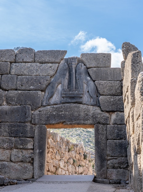 Lions Gate at Mycenaean Ruins Acropolis, Greece, featuring ancient stone architecture.