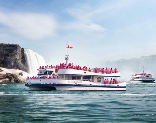 Hornblower Cruise near Niagara Falls with passengers in pink raincoats.
