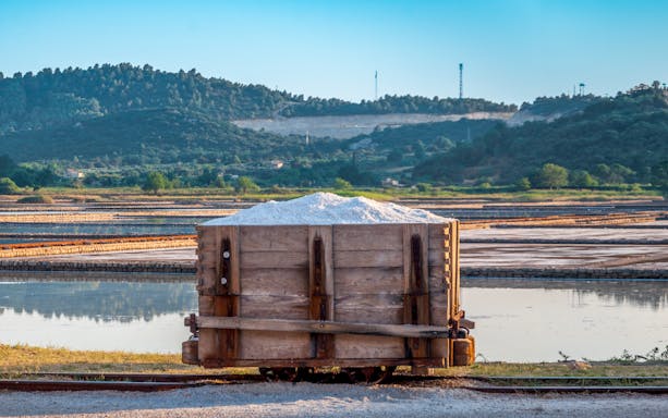 Salt cart at Ston saltworks with salt marshes in Croatia.