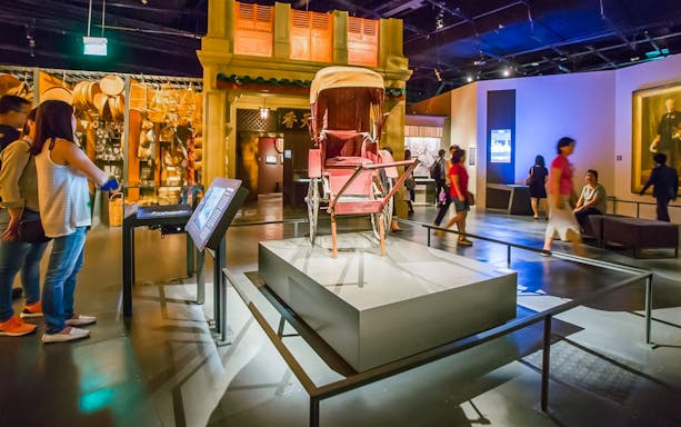 Visitors exploring exhibits at the National Museum of Singapore.