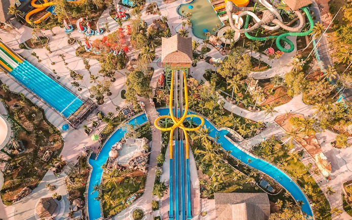 Aerial view of Aquatopia water park with slides and lazy river.