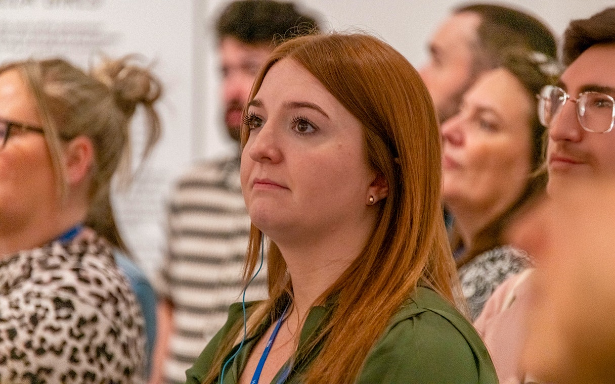 Guests attentively listening during a tour at Tate Modern.