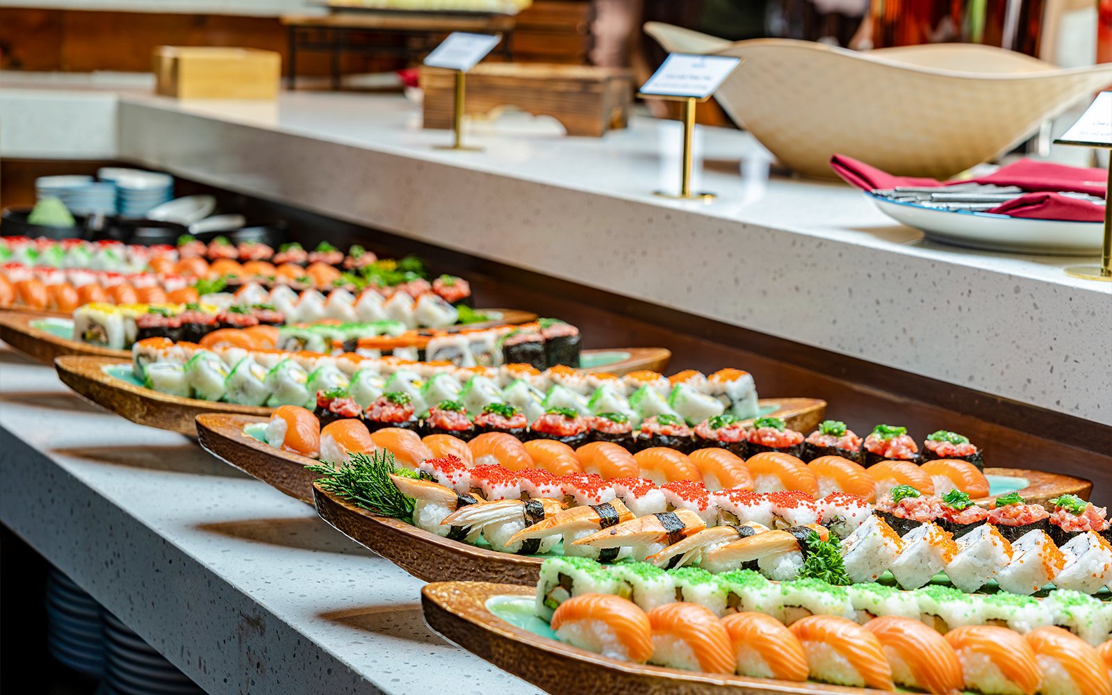 Sushi platters on display during a dolphin cruise dining experience.