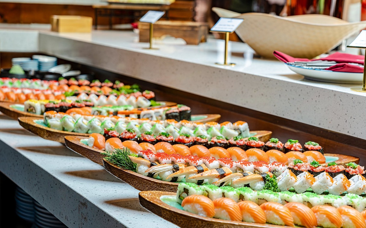 Sushi platters on display during a dolphin cruise dining experience.