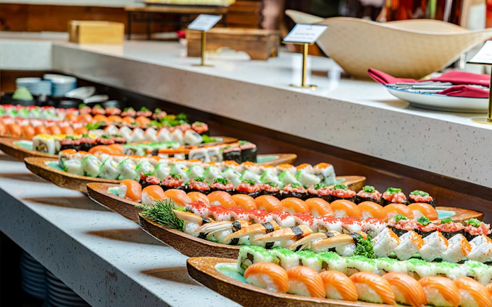Sushi platters on display during a dolphin cruise dining experience.