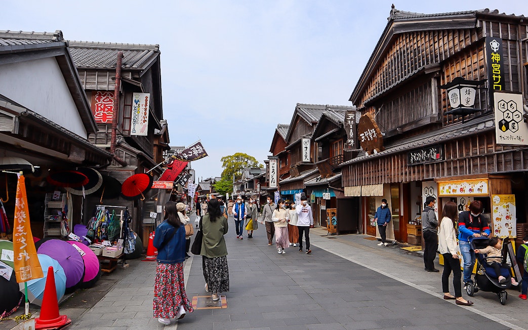 Pedestrian street in Ise, Japan with traditional wooden shops, accessible via Kintetsu Rail Pass.