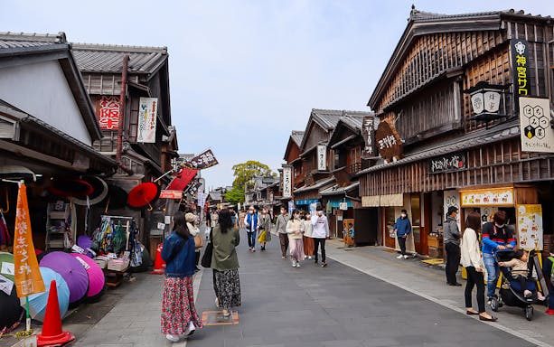 Pedestrian street in Ise, Japan with traditional wooden shops, accessible via Kintetsu Rail Pass.
