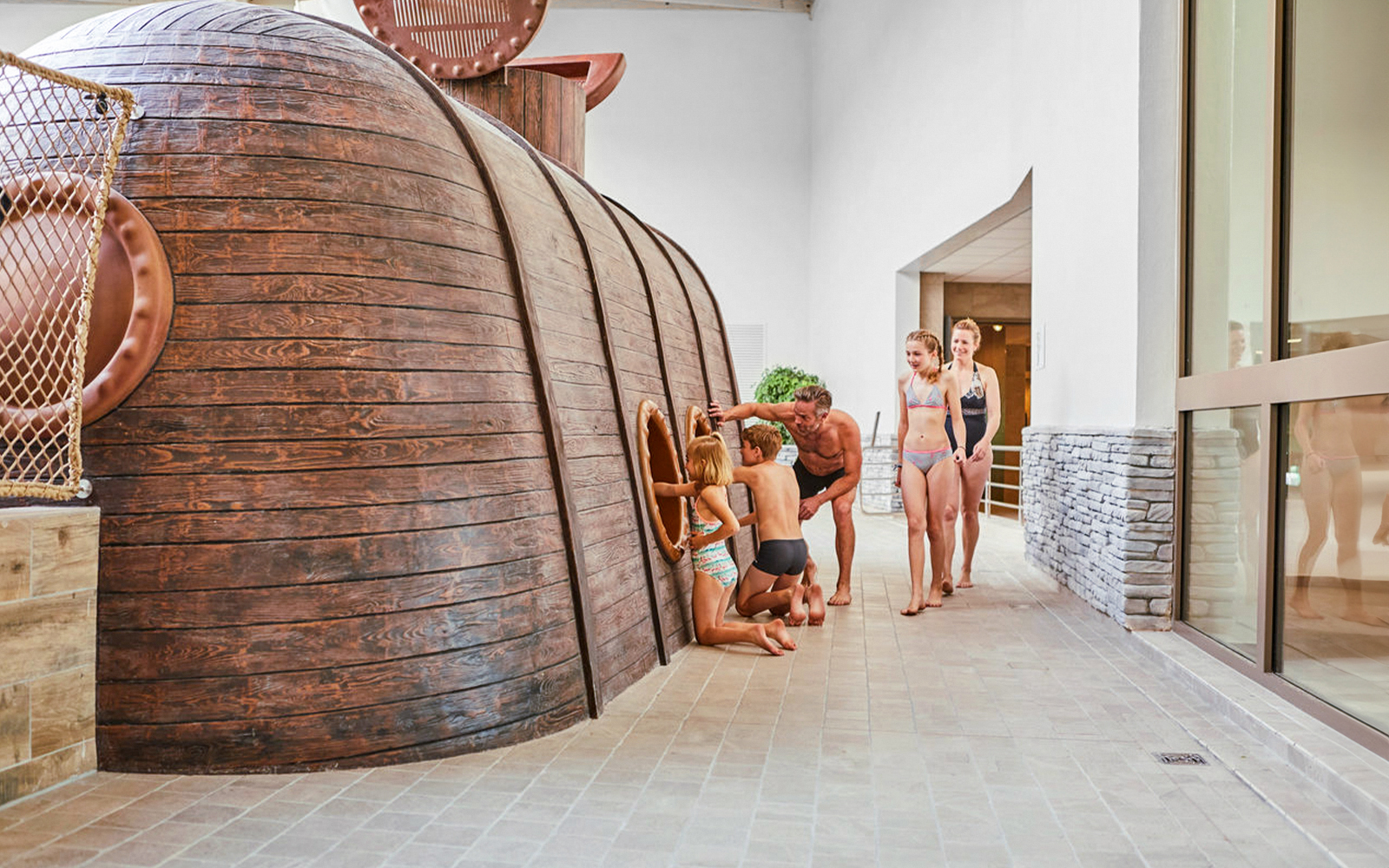 Children exploring submarine-themed play area at Bellewaerde Aquapark, Ypres.