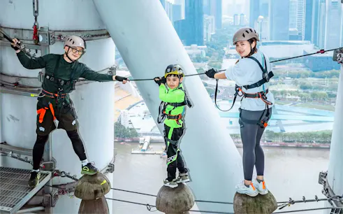 Participants on a high-altitude ropes course at Alpha Discovery Park, Canton Tower, Guangzhou.