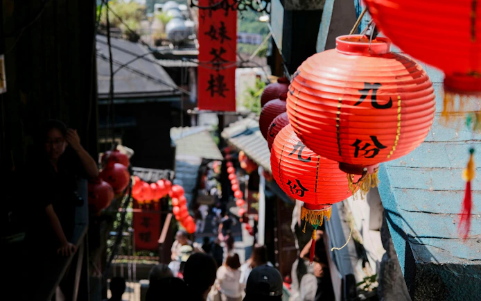 Chinese lanterns line Jiufen Old Street's narrow alley in New Taipei City, Taiwan.