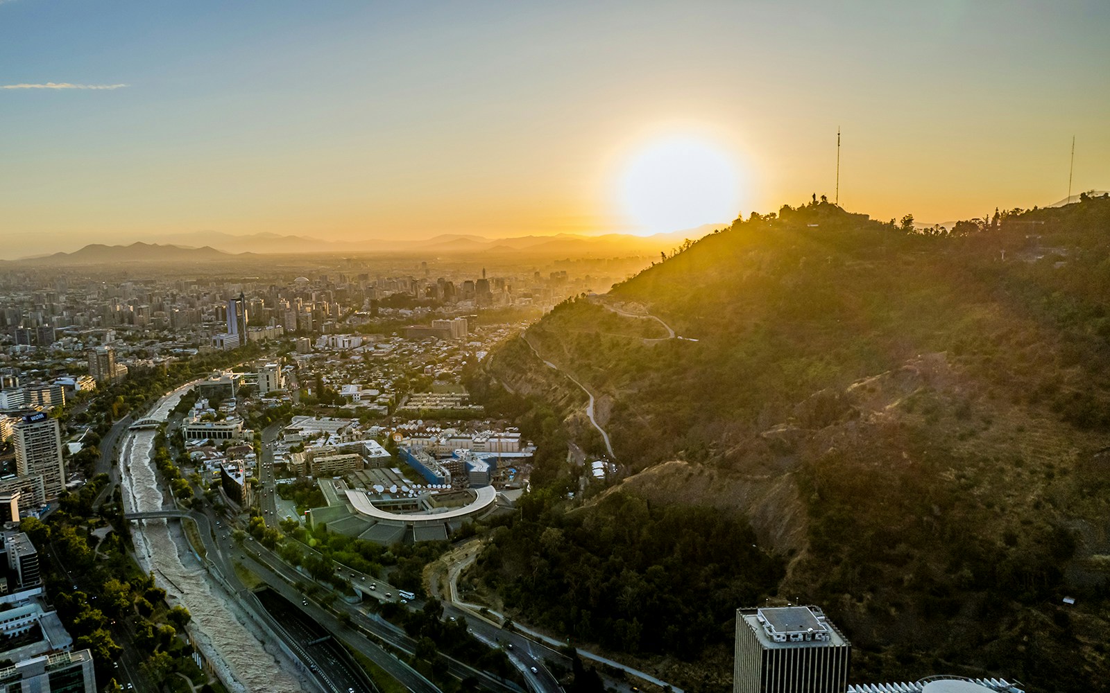 Aerial view of San Cristobal Hill and Santiago de Chile at sunset from Sky Costanera.