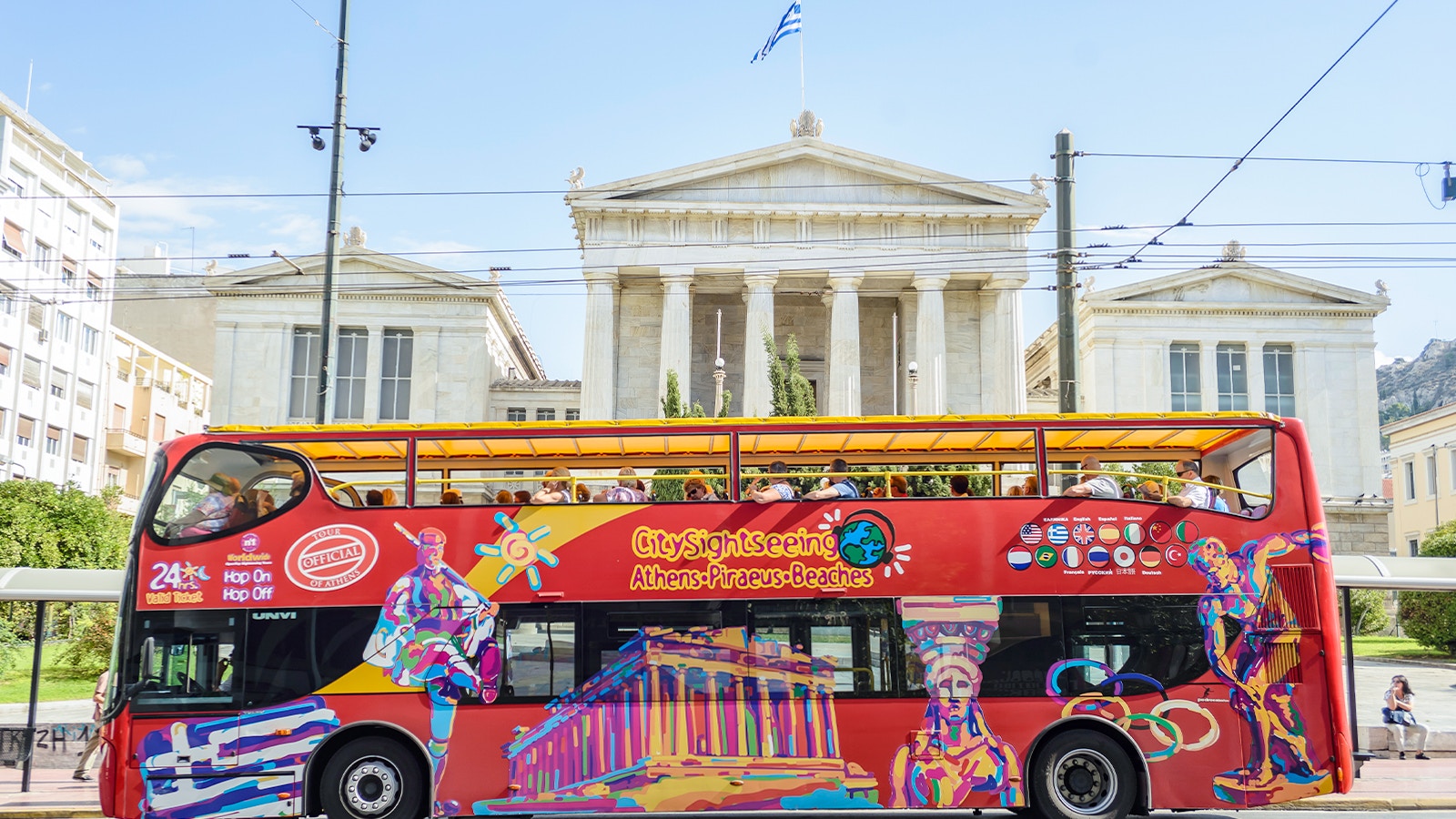 Athens sightseeing bus tour with view of Acropolis, related to San Francisco Gay Men's Chorus event.