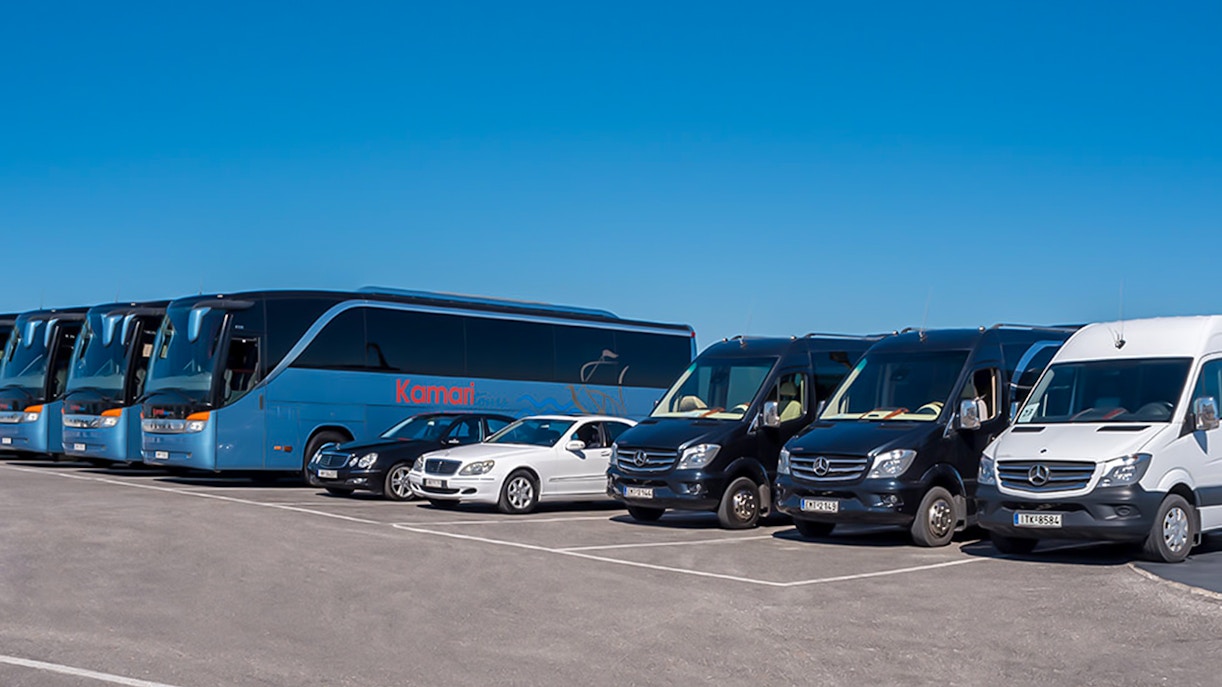 Tour buses and vans for Akrotiri Excavations and Red Beach transfers.