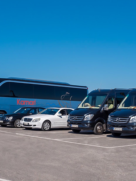 Tour buses and vans for Akrotiri Excavations and Red Beach transfers.