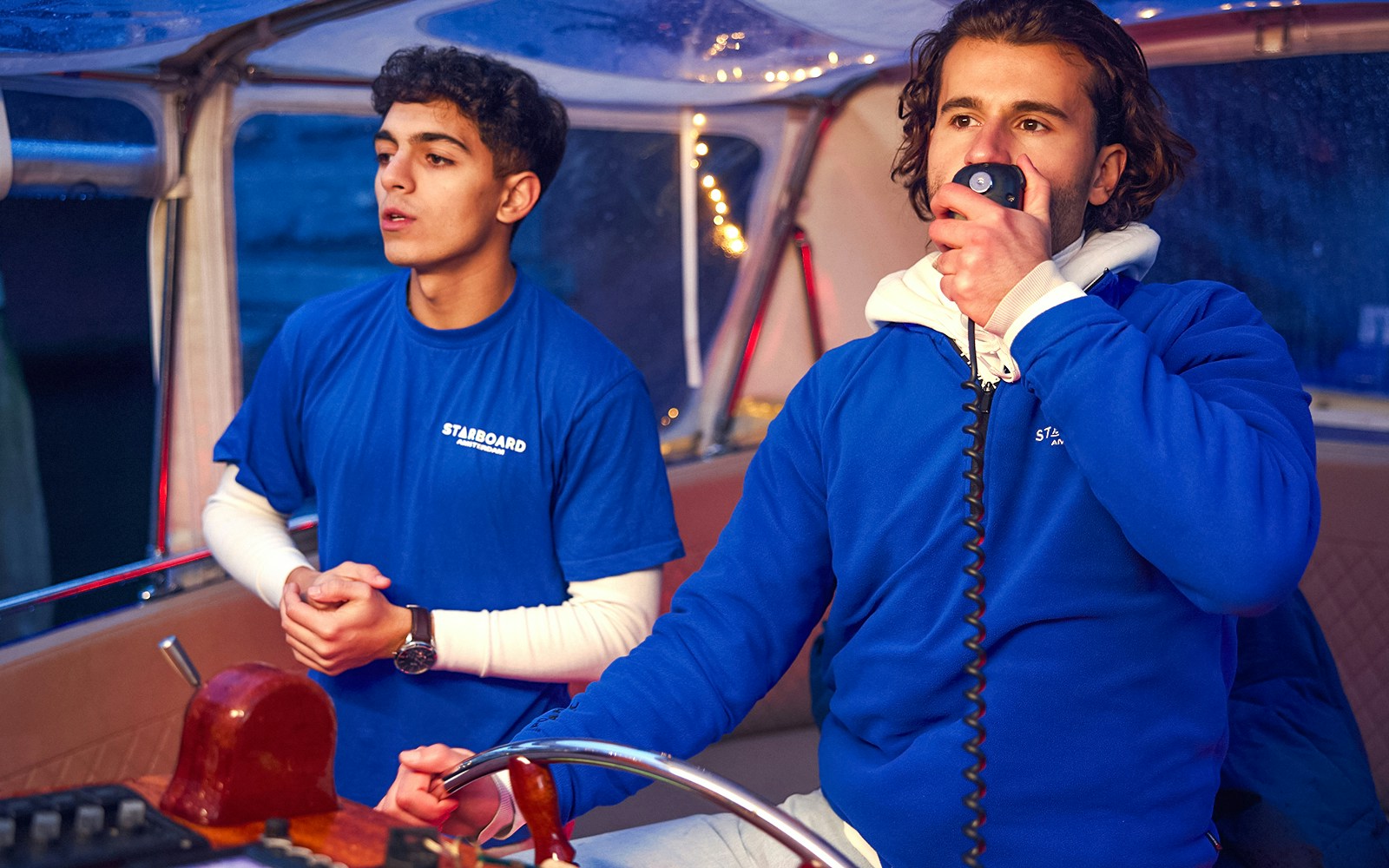 Boat crew guiding Amsterdam Light Festival private cruise.