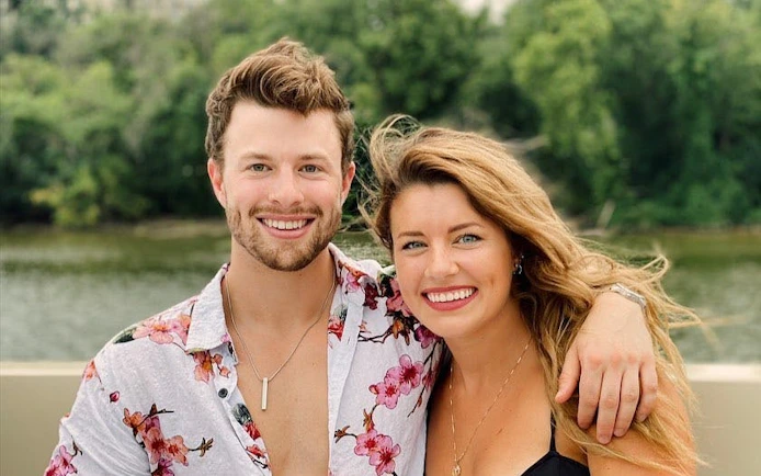Couple enjoying Washington, DC yacht cruise with river view.