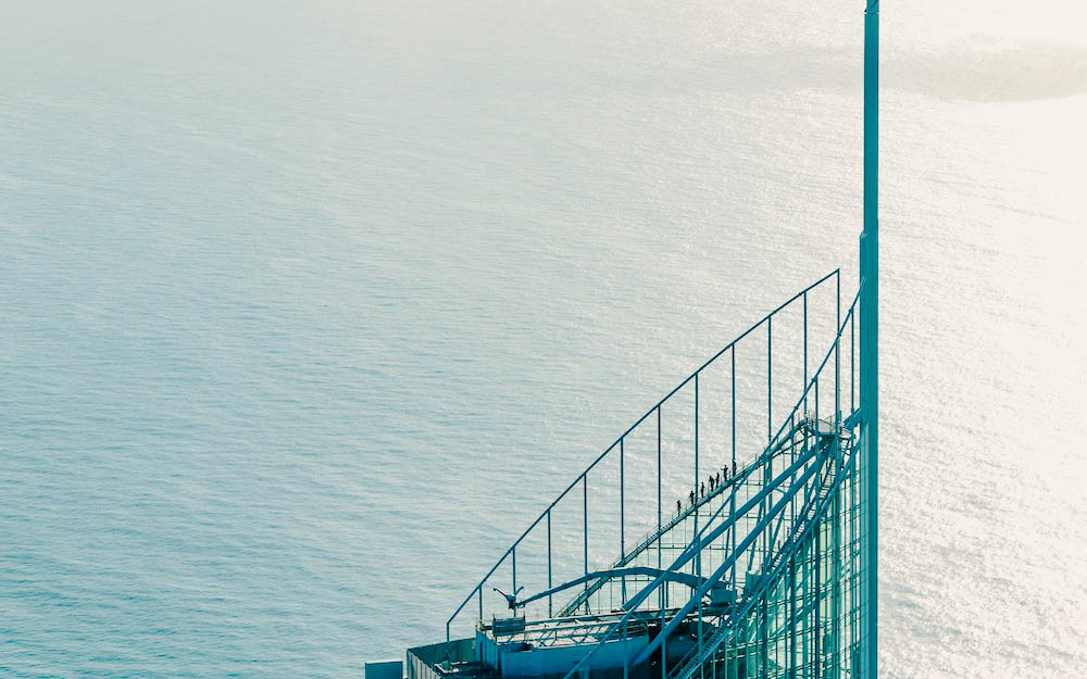 Climbers on SkyPoint observation deck overlooking ocean, Gold Coast, Australia.