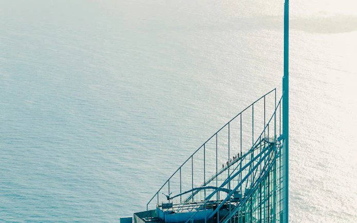Climbers on SkyPoint observation deck overlooking ocean, Gold Coast, Australia.