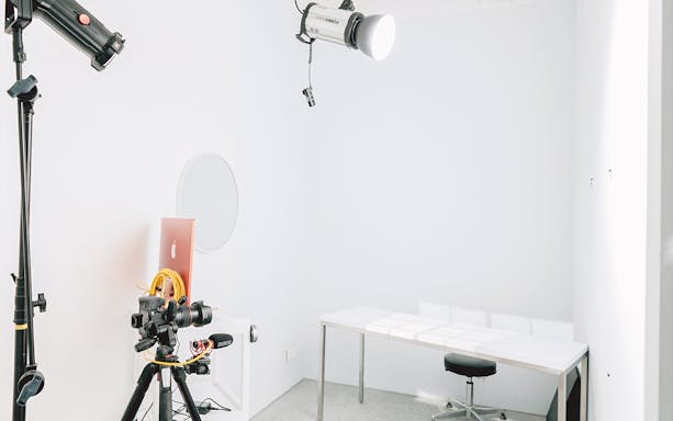 Photography studio setup with camera, lighting, and desk at Studio Seeik, Seoul.