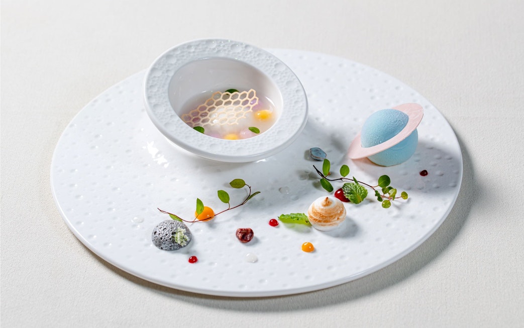 Curated dish with artistic elements on a themed tray at Taste of China, Shanghai.