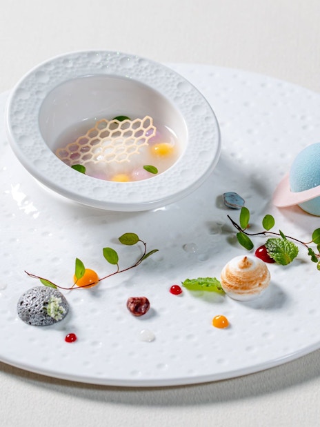 Curated dish with artistic elements on a themed tray at Taste of China, Shanghai.