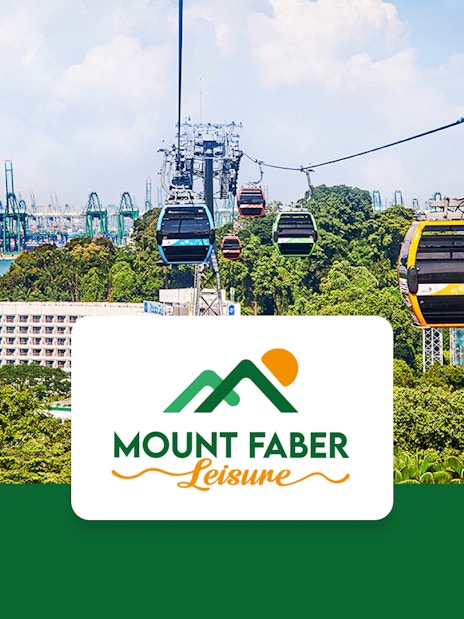Singapore Cable Car over lush greenery with city skyline in the background.
