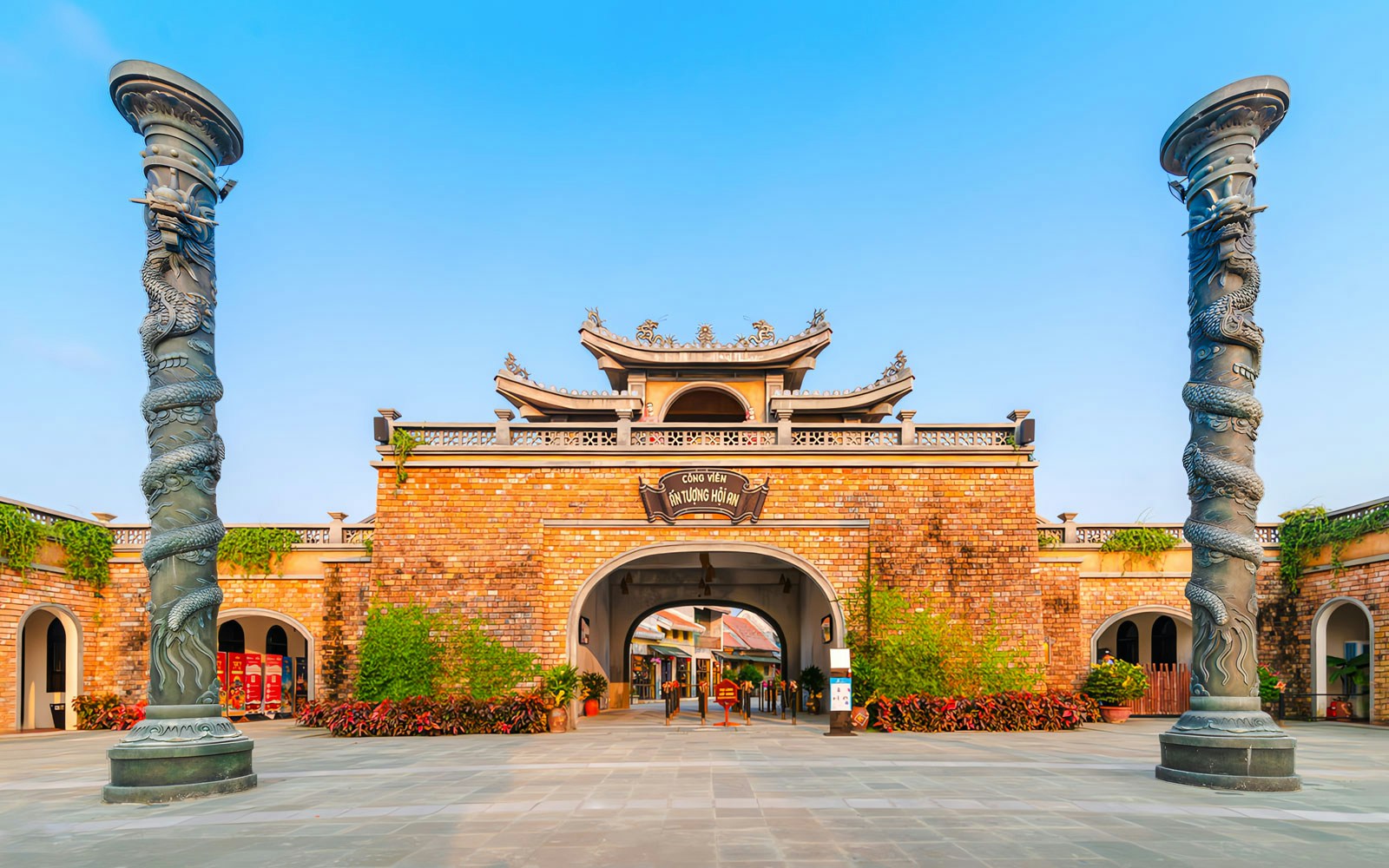 Entrance to Impression Theme Park with dragon pillars, Vietnam.