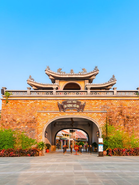 Entrance to Impression Theme Park with dragon pillars, Vietnam.