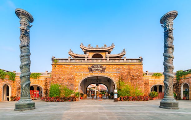 Entrance to Impression Theme Park with dragon pillars, Vietnam.