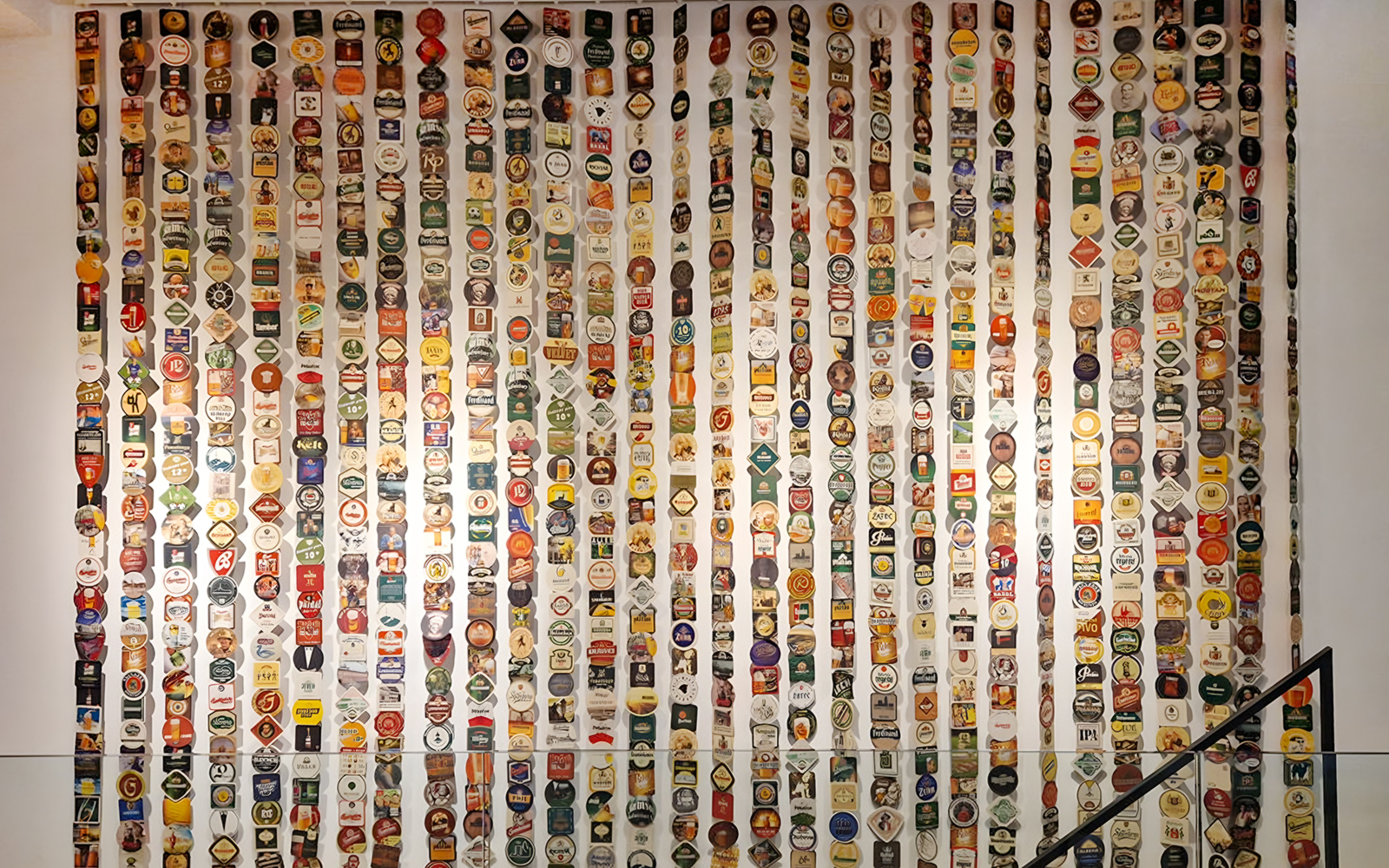 Beer label collection display inside Prague Beer Museum.