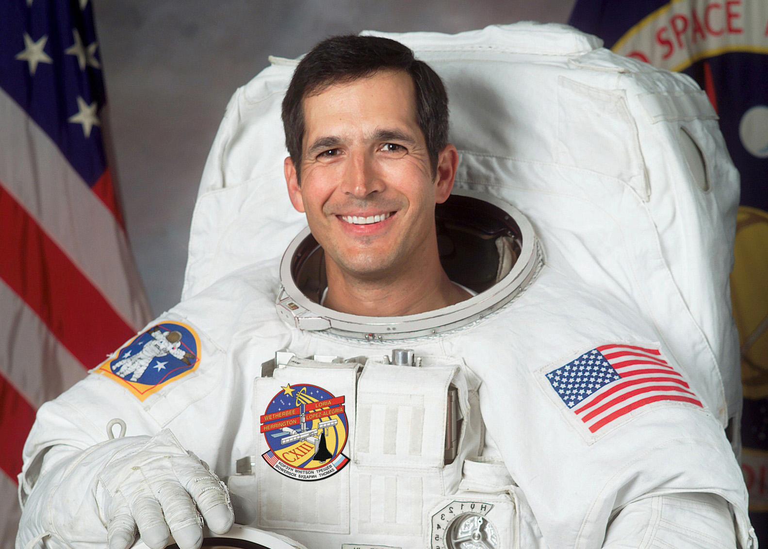 Astronaut John Herrington in space suit during NASA mission.