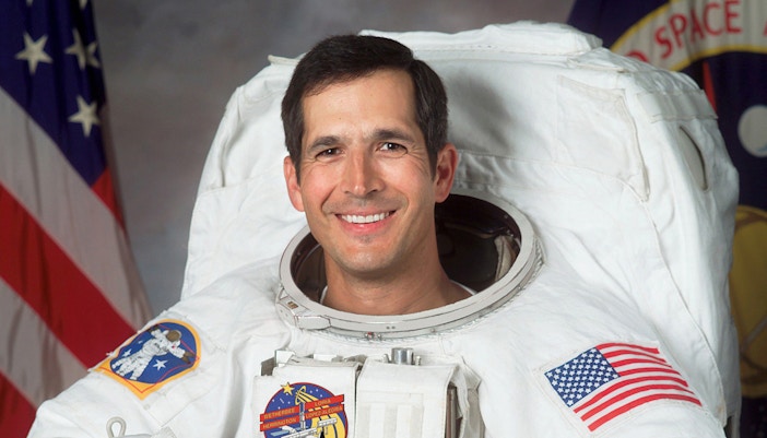 Astronaut John Herrington in space suit during NASA mission.