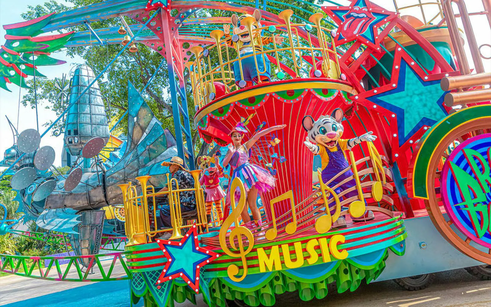 Colorful parade float with characters and musical notes at Chimelong Paradise.