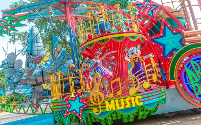 Colorful parade float with characters and musical notes at Chimelong Paradise.