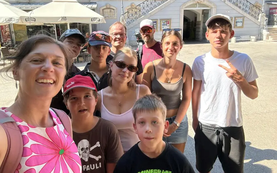 Group of tourists enjoying the Pula Secret Temple self-guided city exploration game.