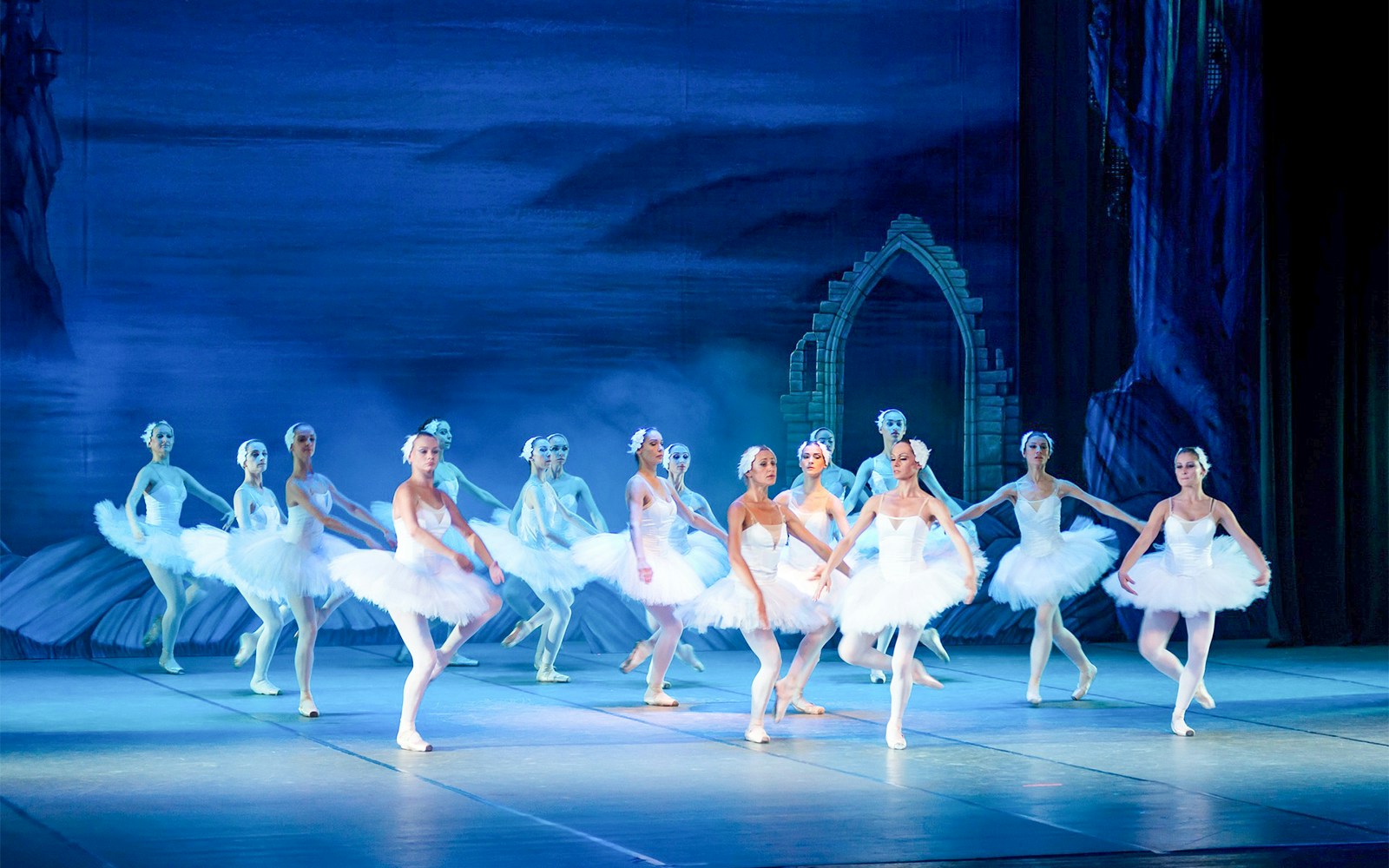 Ballet performance at Sydney Opera House with dancers in white tutus.