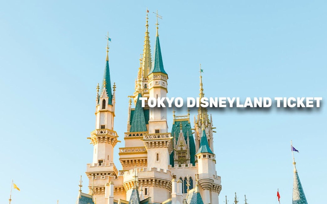 Cinderella Castle at Tokyo Disneyland under clear sky.