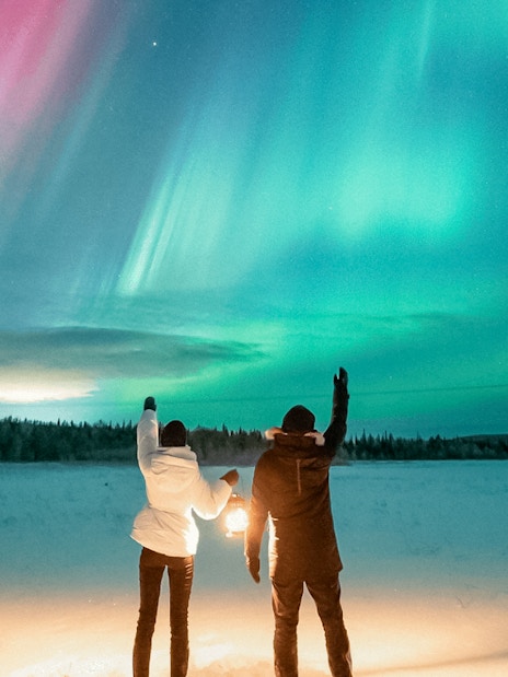 Guests viewing northern lights during Northern Lights Big Group Tour.