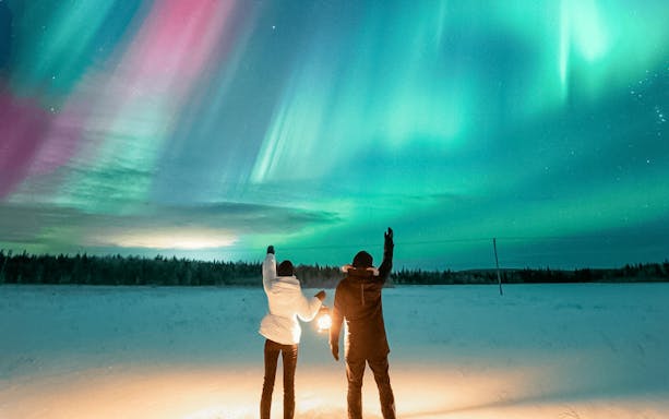 Guests viewing northern lights during Northern Lights Big Group Tour.