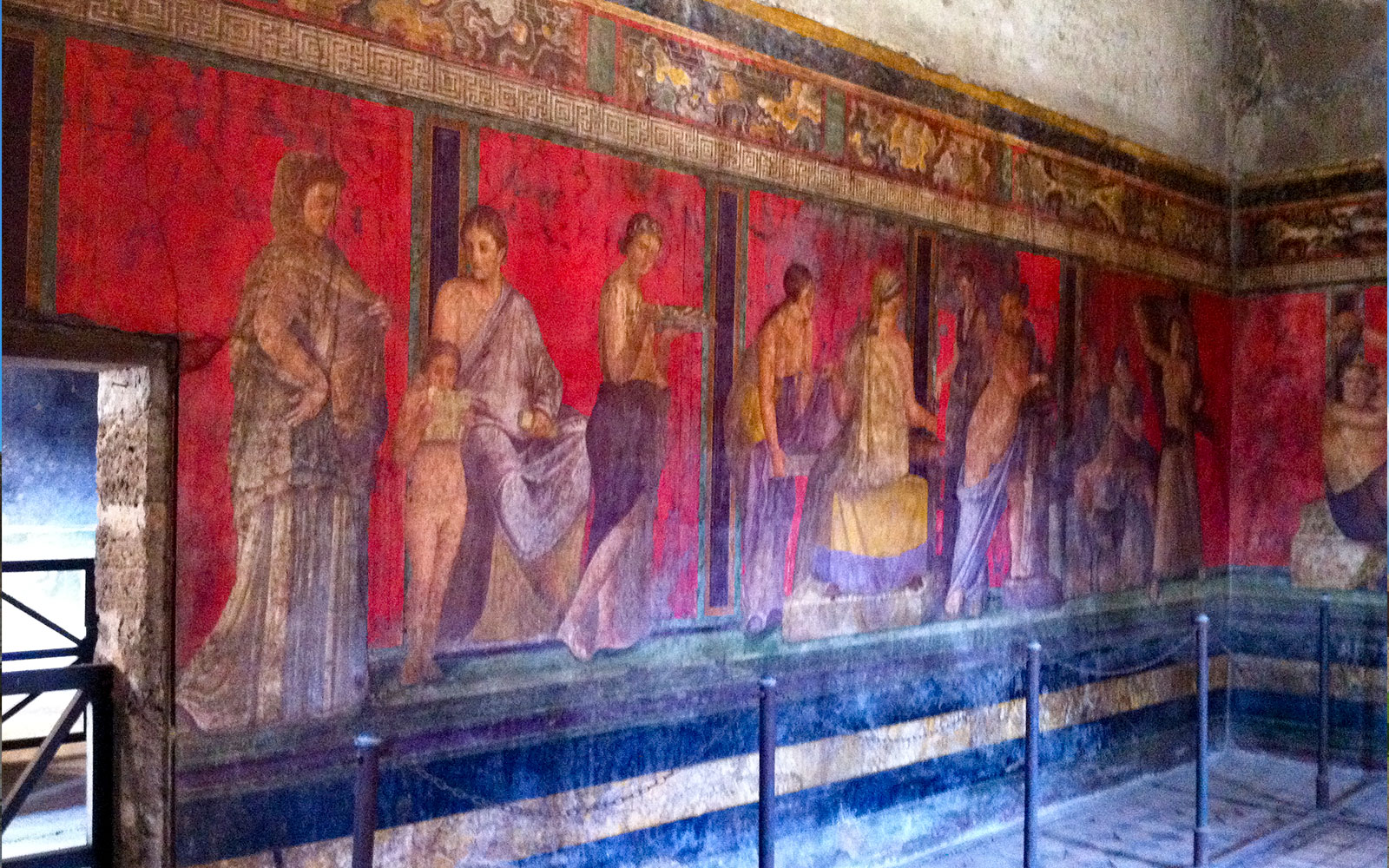 Ancient frescoes in the Villa of the Mysteries, Pompeii, featured on a VIP small group tour.