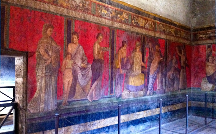 Ancient frescoes in the Villa of the Mysteries, Pompeii, featured on a VIP small group tour.