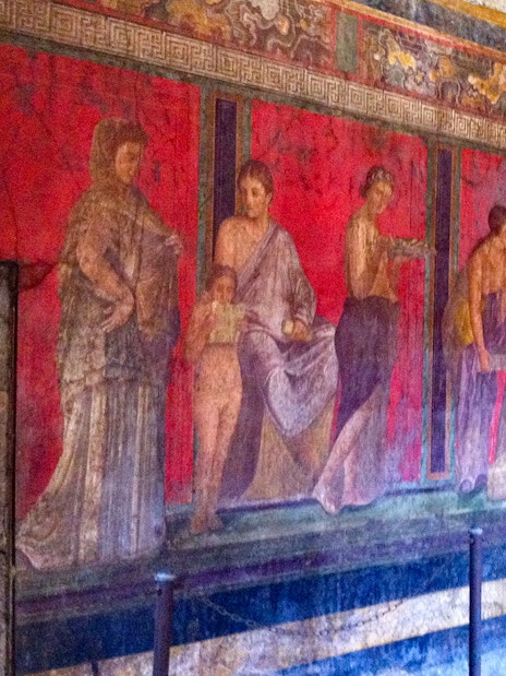 Ancient frescoes in the Villa of the Mysteries, Pompeii, featured on a VIP small group tour.
